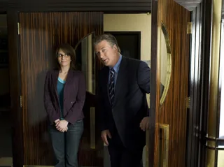 30 Rock: Liz Lemon and Jack Donaghy peering through the studio doors